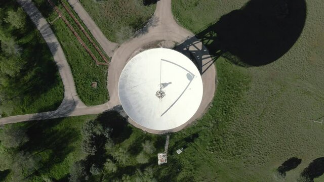 Aerial view of large telecommunications antenna or Radio telescope satellite dish. High quality 4k footage