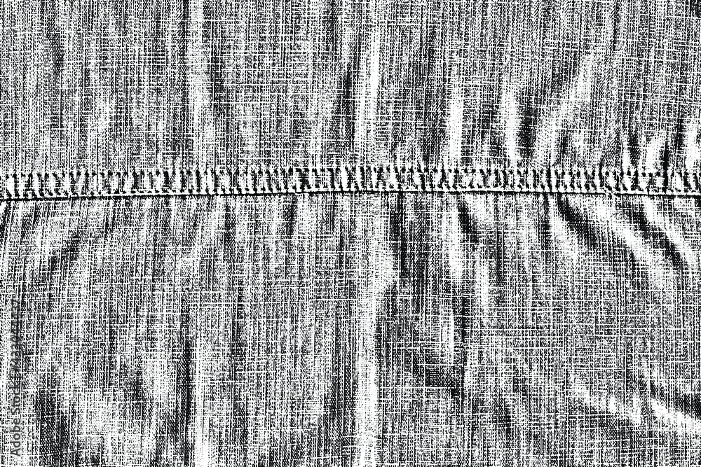 Poster the texture of a natural coarse linen fabric with a rough seam. coarse burlap with a horizontal seam