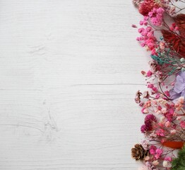 Dried flowers on rustic wooden planks background