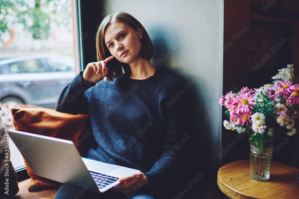 Aufkleber contemplative hipster girl with modern laptop computer for software developing pondering on program 