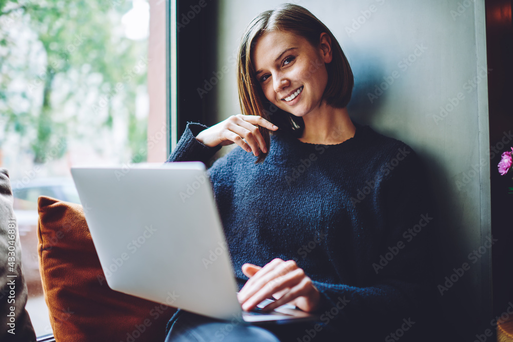 Aufkleber portrait of cheerful hipster girl with modern laptop computer smiling at camera while connecting to 