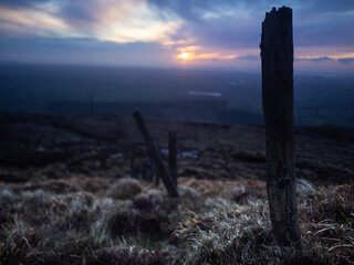 Old fence posts going down side of mountain in Ireland