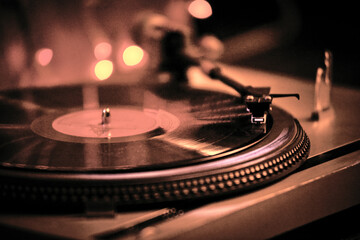 Close-Up Of Turntable Against Illuminated Lights