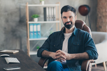 Photo portrait of young recruiter sitting in office on interview smiling thoughtful