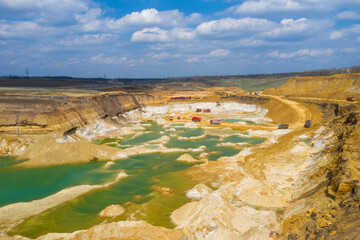 Quarry, mining and construction, excavators and trucks, view from above