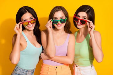 Photo of young beautiful attractive smiling cheerful girls best friends in sunglass isolated on...