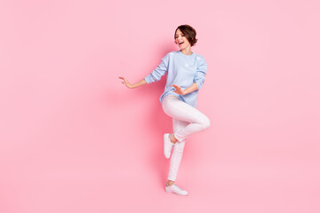 Fototapeta na wymiar Full size photo of happy funky excited good mood charming lovely woman dancing isolated on pink color background