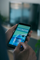 man and text vaccination in his smartphone
