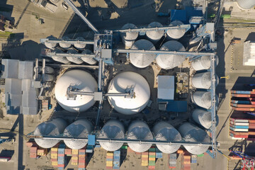 Aerial view oil terminal is industrial facility for storage of oil and petrochemical products ready for transport to further storage facilities.