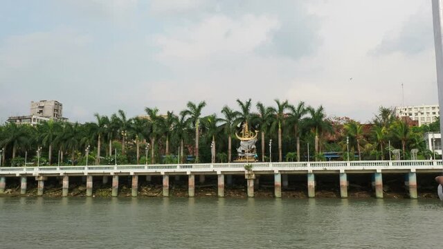 KOLKATA, INDIA - May 02, 2021: Peaceful views of the coconut tree at the bank of river Hoogly, Kolkata