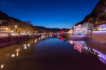 Old Ottoman houses night panoramic view by the Yesilirmak River in Amasya City. Amasya is populer tourist destination in Turkey.