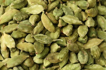 Green cardamom pods background