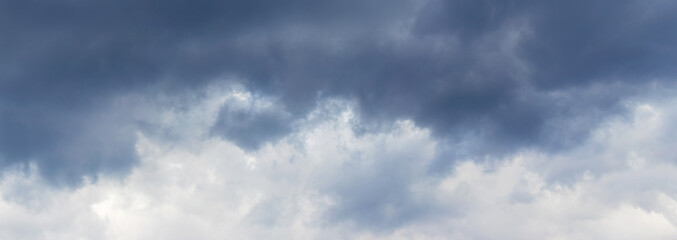 Dark clouds cover the sky. Dramatic stormy sky
