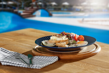 Mediterranean breakfast on a wooden table on a beautiful sunny day 