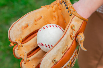 Baseball in hand and glove. Throw. Baseball equipment. Sport. The game. Advertising. Place for an...