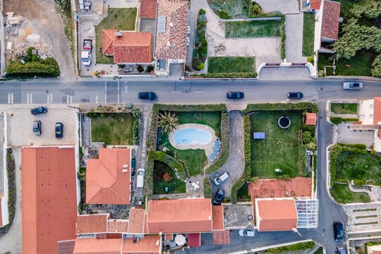 Aerial view of a luxury residential district, view from top of roofs with private swimming pool, Colares, Portugal.