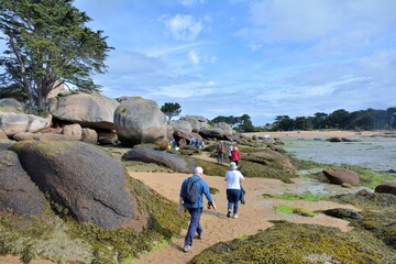 Senior hikers at Tregastel in Brittany. France