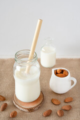 Close-up of homemade almond milk with an ecological bamboo straw