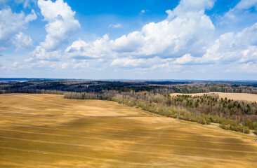 Aerial view of agricultural landscape with fields in spring season.