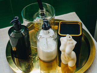 Fototapeta na wymiar Set of soap, hand cream, candle and aromatic sticks in bathroom