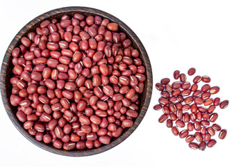 red beans in wooden bowl on white background, top view