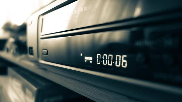 VCR timer display, starting and playing tape. Video cassette recorder