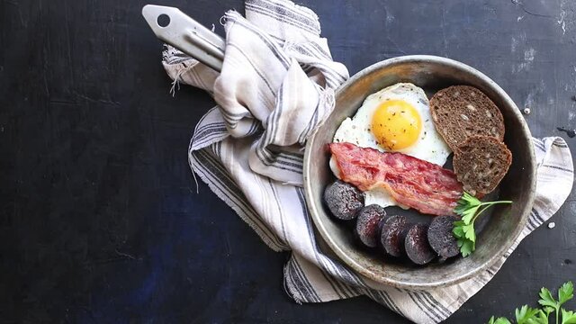 english breakfast fried egg black pudding blood sausage, cereal bread scrambled eggs, on the table wholesome food healthy meal snack copy space food background rustic. top view