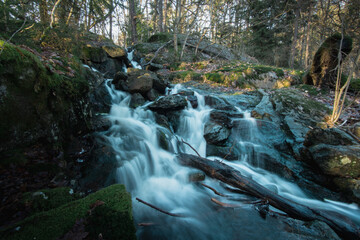 Long exposure photo of a beautiful waterfall in the Swedish forest.