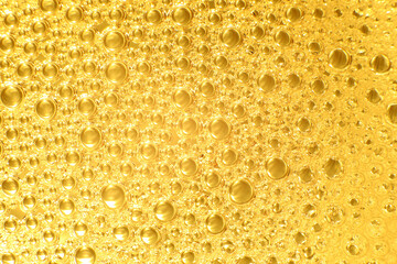 Macro photo of air bubble float on water with color golden lighting for background or wallpaper.
