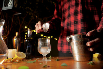 Man preparing drink with lemon