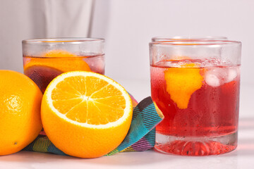 Cocktail drink-orange juice fresh juice with strawberry with lemon orange, mango, pineapple, apple, grapes isolated on white background. High-resolution image