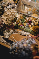 Table of a florist's workshop with a set of dry flowers