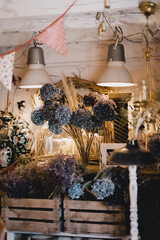 Decoration shop with wooden boxes and dried flowers