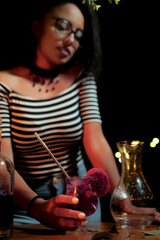 Friends toasting with tropical drinks with colorful fruits