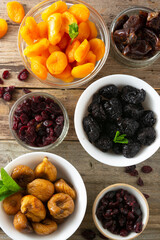 Dried fruits mix in bowls, healthy snack, sweet fruits, vegan food