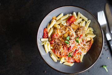 Eggplant penne Pasta alla Norma or Amatriciana guanciale Rigatoni tomato sauce cheese vegetable second course snack trend meal copy space food background rustic 