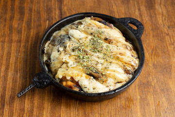 provoleta en plancha a la parrilla