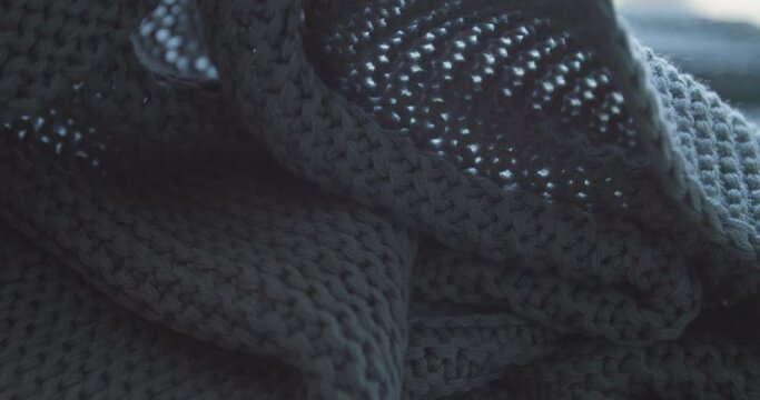 Knitted grey blanket, closeup view
