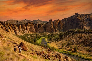 Two men hiking the trails along the Crooked River in Smith Rock State park near Terrebonne, Oregon