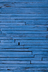 The texture of the background is from thin old boards painted in a rich blue indigo color with a...