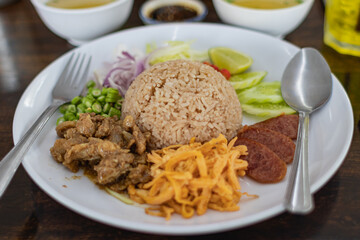 Shrimp paste fried rice in a plate and cutlery