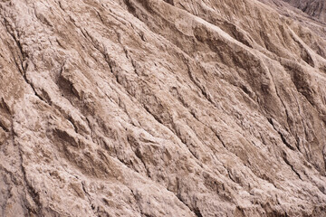 Red rocks slope looks like martian landscape. Textured background.