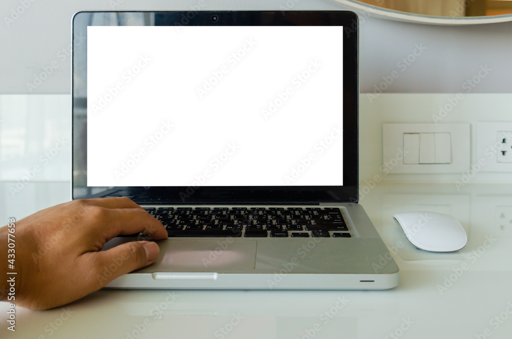 Aufkleber hand on keyboard computer laptop mock up and mouse white blank screen for advertising text on table.
