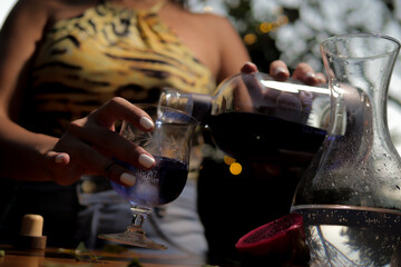 Black woman having Brazilian drink with fruit