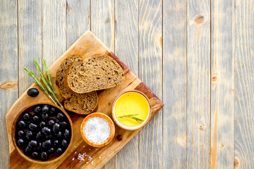 Sliced bread ciabatta with olives and oil. Greek or Italian meal