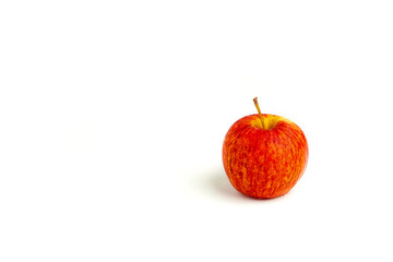 Whole red, yellow apple cutout on isolated white background. This juicy healthy fruit is very tasty and has natural vitamin with antioxidant nutrition. Eat as health and diet food.