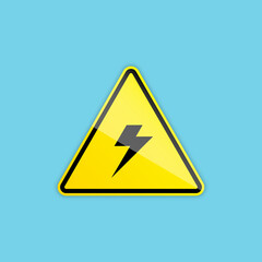 A warning sign of electricity has a triangular form and a lightning symbol. The sign is isolated on a light blue background.