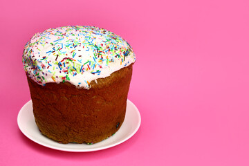 easter cake with colorful powder on a pink background