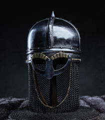 Studio shot of iron helmet against dark background
