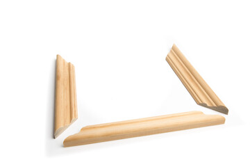 several pieces of wood molding with miter cuts to make a picture frame isolated on white